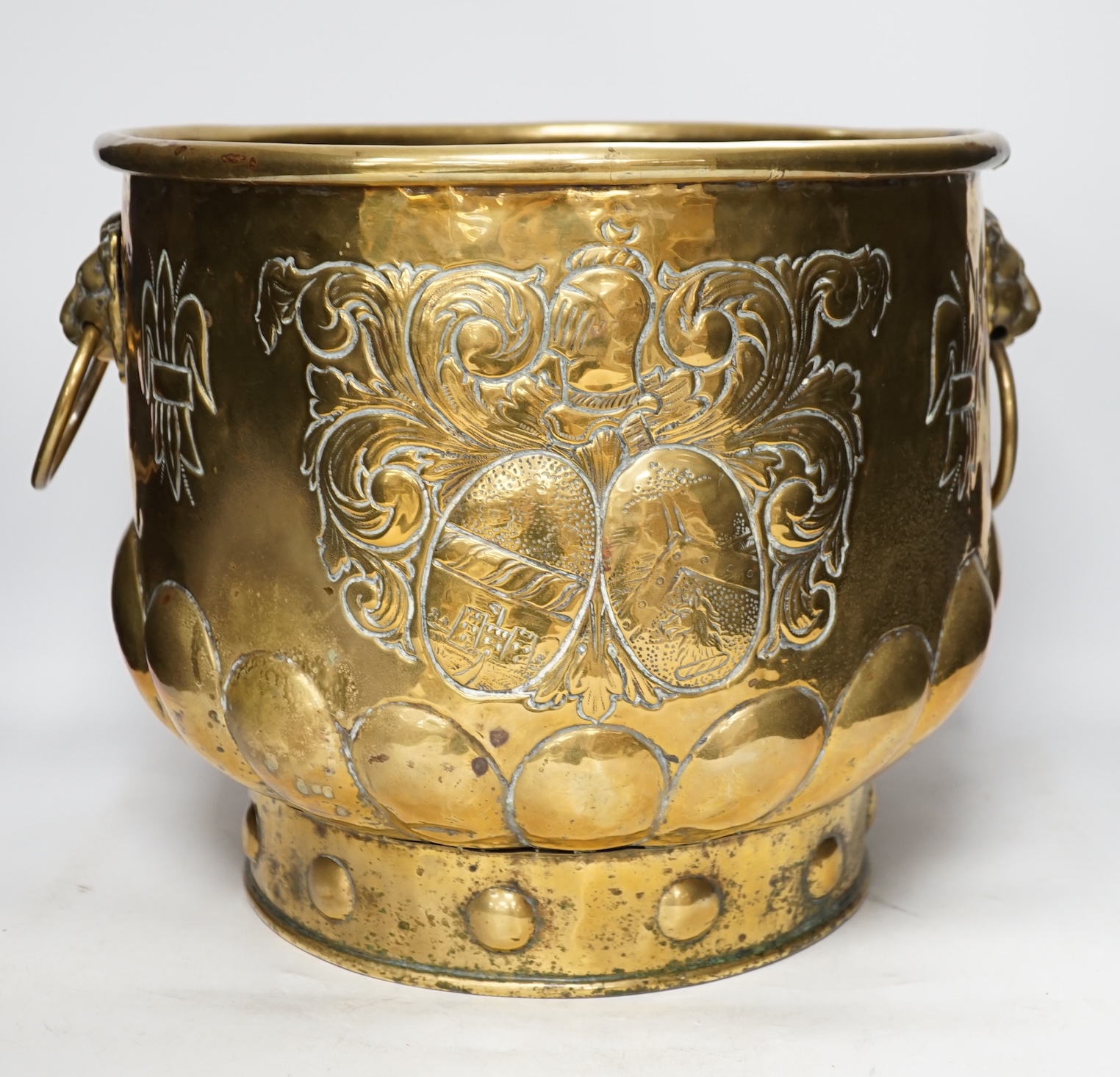 A 19th century Dutch embossed brass log basket, 33cm. Condition - poor, not original base